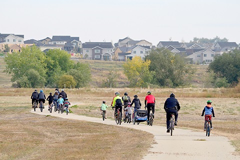 People riding along a trail.